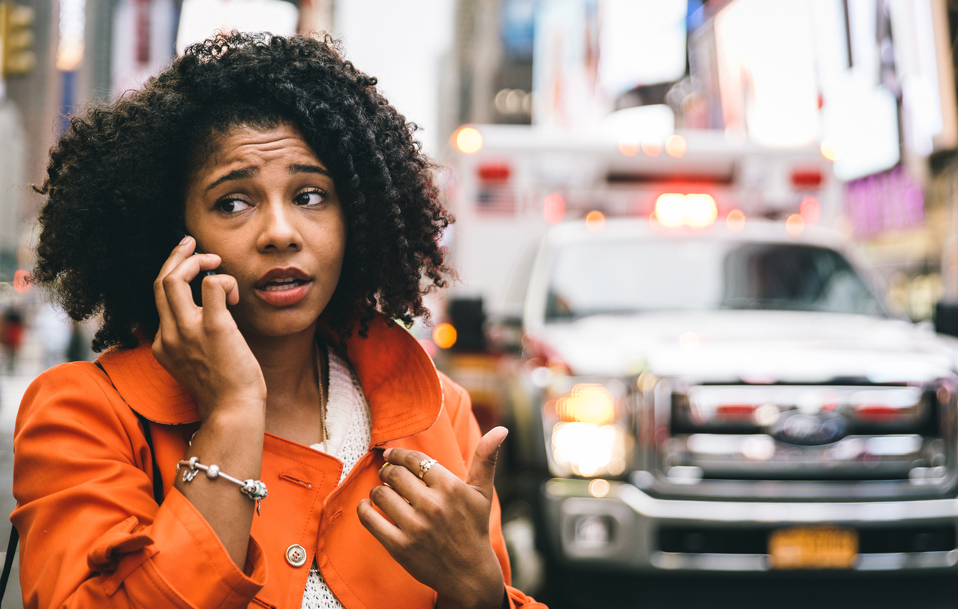 Female on the street calling 911 